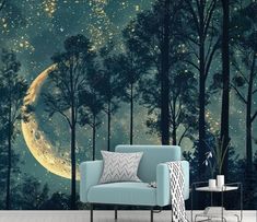 a living room with a couch, chair and wall mural