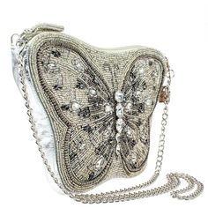 Mary Frances Flitter & Gleam Crossbody Butterfly Handbag Beaded Silver Bag New Flutter away in style with this butterfly-inspired silver beaded crossbody handbag. This trendy bag features glass and smokey grey rhinestones for a whimsical feel and a detachable silver chain shoulder strap so you can unfold your wings and go out in elegance. 11 x 1 x 7" Strap Length End to End: 49" Strap Drop: 23.5" Removable crossbody chain strap, zipper closure, inside pocket, back pocket, fits a cell phone, genu Butterfly Handbag, Event Shoes, Novelty Handbags, Handbag Boutique, Silver Bag, Mary Frances, Silver Bags, Brown Handbag, New Bag