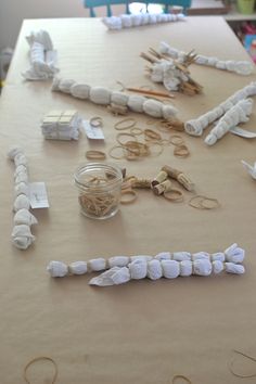 the table is covered with paper machs and other crafting supplies for making toothpicks