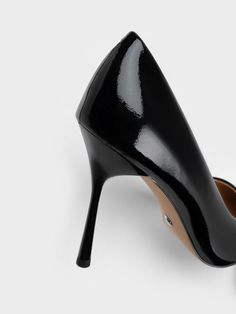 Indulge in the high-shine trend with our Kyra patent leather pumps. These pumps exude a timeless elegance in classic black patent, making them both striking and incredibly versatile, seamlessly fitting into any wardrobe and complementing various style preferences. The sleek pointed-toe silhouette, paired with the slender stiletto heels, creates an illusion of longer legs, making them the perfect choice for days when you want to make a statement and stand out from the crowd. Longer Legs, Charles Keith, Patent Leather Pumps, Long Legs, Black Pumps, Leather Pumps, Classic Black, Patent Leather, Stiletto Heels