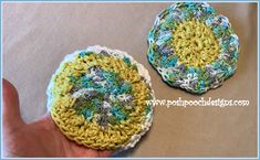 two crocheted coasters sitting next to each other