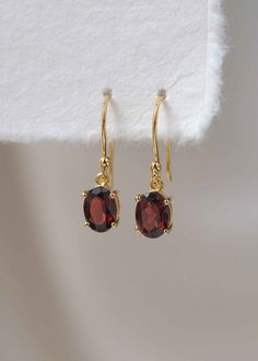 Our Garnet Dangle Earrings in gold vermeil are just the right size to be noticed and small enough to wear all day comfortably. The stone is a large 8mm natural deep red genuine Garnet popular as a January birthstone. Also available in sterling silver, see earrings section. Sold as a pair, comes with extra silicone ear backs to keep them secure.DETAILS• Dimensions: 8mm x 6mm, total length - 24mm• Material: 18k gold vermeil over 925 sterling silver base, genuine Garnet• Birthstone month - January Elegant Gold-plated Birthstone Earrings, Elegant Gold Plated Birthstone Earrings, Classic Gemstone Earrings Perfect As Gifts, Classic Gemstone Earrings As Gift, Classic Gemstone Earrings For Gift, Classic Birthstone Drop Earrings, Month January, Chunky Silver Rings, Garnet Birthstone