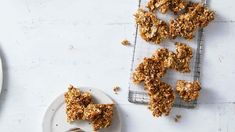 several pieces of granola on a plate next to a fork