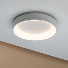 a circular light fixture mounted on the ceiling