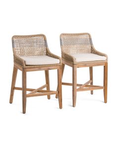 two wicker chairs sitting next to each other on a white background with no one in it