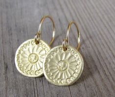 "Beautiful handmade gold Mandala flower discs swing from gold filled ear wires. ❉ F A C T S total length from top of ear wire: 1\" /2.5 cm disc: 0.5\"/ 1.3 cm diameter You will receive this Mandala Jewelry in a gift box, with an inspiring card, ready to be given as an empowering gift. Your earrings may vary slightly from the ones in the picture. Each pair is handmade to order. Feel free to contact me for any custom request : http://www.etsy.com/convo_new.php?to_username=ravitschwartz This design Gold Earrings With Flower Charm For Everyday, Everyday Gold Earrings With Flower Charm, Handmade Gold Flower Earrings For Everyday, Gold Round Flower Earrings For Everyday, Gold Round Flower Earrings With Ear Wire, Mandala Jewelry, Mandala Earrings, Gold Disc Necklace, Mandala Necklace