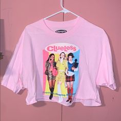 A Clueless Crop T-Shirt Never Worn 90s Inspired Tops With Funny Print For Spring, 90s Inspired Short Sleeve Tops With Funny Print, 90s Inspired Funny Print Tops For Spring, Spring Tops With Funny Print In 90s Style, Pop Culture Screen Print Tops For Summer, 90s Inspired Short Sleeve Crop Top For Spring, Summer Screen Print Pop Culture Tops, Y2k Style Screen Print Tops For Spring, 90s Inspired Screen Print Tops For Summer