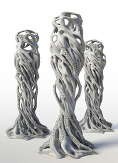 three white sculptures are shown on a white surface