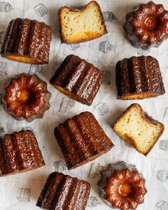 several pieces of cake sitting on top of a white table cloth next to each other