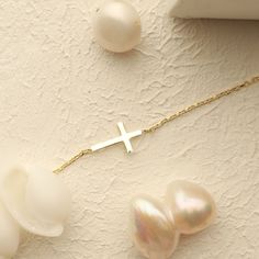 This beautiful, dainty cross bracelet is the perfect gift for a special women or young girl celebrating her first communion. Crafted from brilliant gold, this piece of cross jewelry will remind her of her each time she wears it. Can you imagine her joy when she opens the gift? Please note that we also offer matching Cross Pendant Necklace in our shop! Elegant Gold Jewelry For Confirmation, Elegant Adjustable Gold Cross Necklace, Dainty Yellow Gold Rosary Bracelet As Gift, Elegant Cross Rosary Bracelet As Gift, Dainty 14k Gold Jewelry For Baptism, Elegant Cross Jewelry For First Communion, Elegant Crucifix Jewelry For Baptism, Elegant Rosary Bracelet With Cross For Gift, Delicate Gold Rosary Bracelet Gift