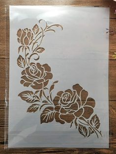 the stencil is being used to make a flower design