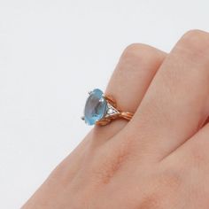 Elevate your style with our 14k Yellow Gold Blue Oval Topaz and Diamond Cocktail Ring. The stunning 6ct oval cut blue topaz steals the show, while the 2 accent round brilliant cut diamonds (0.02ct each) add just the right amount of sparkle. Crafted with a 2.5mm shank, 12mm head, and size 6.5 ring, this ring is sure to make a statement. Shank size: 2.5mm Head size:12mmRing size: 6.5Oval cut blue topaz (est. 6ct)2 Accent round brilliant cut diamonds (0.02ct each)Stone clarity: I1Stone color H-JGol Oval Blue Topaz Ring With Diamond Accents, Oval Topaz Ring With Diamond And Gemstone Accents, Elegant Oval Blue Topaz Birthstone Ring, Blue Oval Birthstone Ring With Diamond Accents, Elegant Oval Aquamarine Birthstone Ring, Oval Topaz Ring With Aquamarine And Gemstone Accents, Oval Sapphire Topaz Ring With Diamond Accents, Oval Topaz Ring With Diamond Accents, Oval Topaz Ring With Gemstone Accents