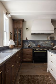 a kitchen with an oven, stove and counter tops in it's center island