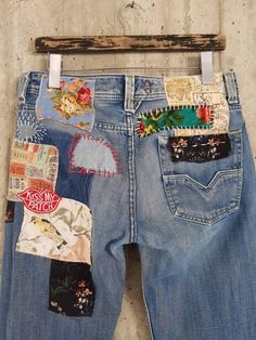 an old pair of jeans with patches on them