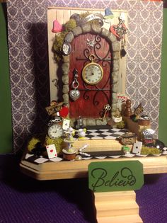 a doll house with a clock and other decorations