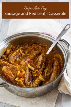 sausage and red lentil casserole in a pan with a spoon on the side