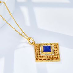 This stunning Lapis Lazuli Cube Hollow Necklace exudes vintage charm and refinement. With its delicate hollow design, it is a stylish and versatile addition to any jewelry collection. Material: 925 sterling silver plated with 18K gold, 5A zirconMain stone: natural lapis lazuliPendant: 2*2cmChain length: 46cm Elegant Sapphire Color Gold-plated Necklace, Elegant Sapphire Color Gold Plated Necklace, Exquisite Gold Sterling Silver Necklace, Elegant Sapphire Square Pendant Jewelry, Cubic Zirconia Filigree Necklace As A Gift, Cubic Zirconia Filigree Necklace Gift, Filigree Cubic Zirconia Necklaces As Gifts, Exquisite Gold Plated Pendant Necklace, Filigree Cubic Zirconia Necklace Gift