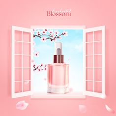 a bottle of pink perfume sitting on top of a window sill next to flowers