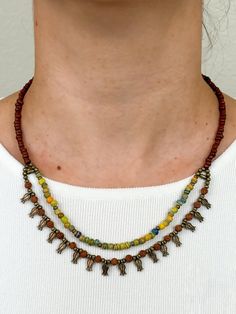 This Handmade Ethnic Necklace is a very unique beaded jewelry, which is going to be yours if you are here.  Its ethnicity and elegance comes from the traditional tribal ethnic design and boho minimalist string structure. It is designed and produced by local shaman artisans. Shamanism is known as a nature worship belief. Shamans bound their soul with nature. Our necklace is designed and is became alive with this bound. If you would like a distinctive, unique, ethnic and dainty necklace, Zoho Accessories is your right place to be ! It's a great necklace for yourself or as a gift for a beloved person on Mother's Day, as a Birthday gift, Christmas gift, and all other special days! Necklace length: 18 Inches (Adjustable length) If you have any questions, write me anytime and I happily to answer Bohemian Tiny Beads Jewelry For Festivals, Bohemian Jewelry With Tiny Beads For Festivals, Bohemian Tiny Beaded Jewelry For Festivals, Spiritual Dangling Beads For Festivals, Spiritual Beaded Necklaces With Dangling Beads For Festivals, Traditional Brown Jewelry With Tiny Beads, Traditional Brown Beaded Necklace For Festival, Earthy Jewelry With Colorful Beads For Festival, Earthy Colorful Beaded Jewelry For Festivals