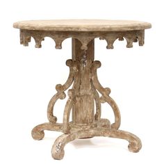 an old wooden table with ornate carvings on it's legs and base, against a white background