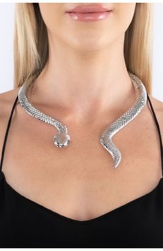 A snake shaped choker necklace adds sultry attitude to your night out looks. 10" length Hinge closure Alloy Imported Silver Snake Necklace For Party, Metal Choker For Night Out, Silver Choker For Night Out, Snake Chain Metal Jewelry For Parties, Silver Snake Chain Choker For Party, Party Snake Chain Metal Choker, Party Jewelry: Clavicle Snake Chain, Party Metal Snake Chain Choker, Metal Evening Choker