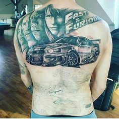 the back of a man's body with two cars on it and an advertisement for fast