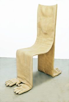 a chair that is shaped like a frog's foot and has been made out of suede