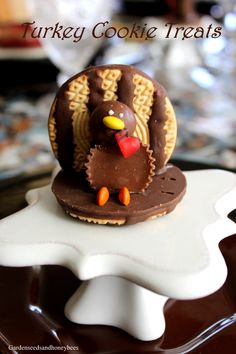 a turkey cookie treat sitting on top of a white plate