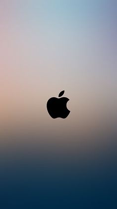 an apple logo is shown on the side of a blurry background with blue and pink colors