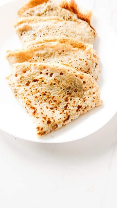 several flat breads on a white plate