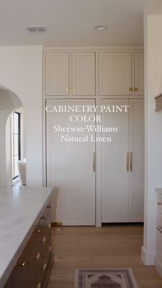 an image of a kitchen with white cabinets and marble counter tops in the middle of it