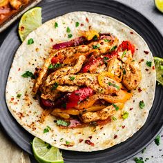 chicken fajita with peppers and onions on a tortilla