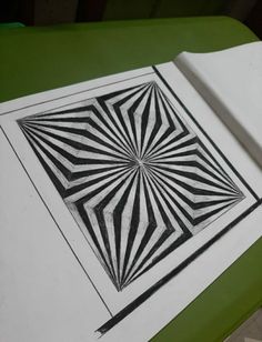 a black and white drawing on top of a green table