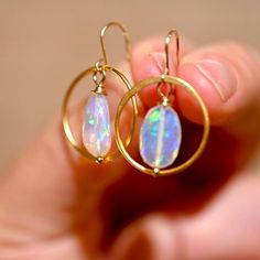 Golden Hoop earrings matched with two gorgeous opals that are a blue hue with a rainbow flash inside. These really bring a fun look to any outfit. Golden Hoops - Gold Vermeil (over .925 sterling silver) Ethiopian Opals - 14 x 9 mm 14 K Gold Filled Ear Wire Length: 1 1/4” Opal Hoop Earrings As A Gift, Golden Hoop Earrings, Opal Drop Earrings, Golden Hoops, Hoops Gold, Blue Hues, Ear Wire, Ethiopian Opal, A Rainbow