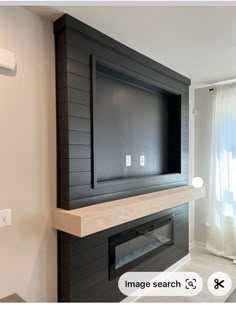 a flat screen tv mounted to the side of a wall