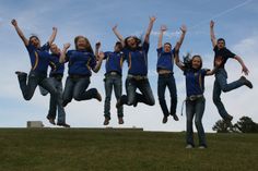 a group of people jumping in the air