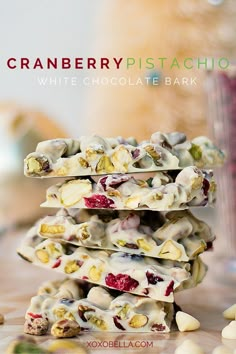 cranberry pistachio white chocolate bark is stacked on top of each other