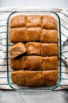 sliced bread in a glass dish on a towel