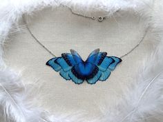 Flower Butterfly Necklace with Azure Blue Silk Wing - best gift for anyone who loves Butterflies! :) Length 45 cm / 17.7 inches My jewelry is made with the most sincere Love and Passion, every Butterfly and wing sewed by me. When you buy a handcrafted product, you'll be sure that only you have such treasure. Handmade jewelry is the best decoration, which allows the owner to express their own individuality. Delicate style of handmade jewelry - the perfect gift for any occasion for women and girls Blue Butterfly Jewelry, Blue Butterfly Necklace For Gift, Blue Butterfly Necklace For Gifts, Handmade Blue Butterfly Necklace, Elegant Blue Sterling Silver Butterfly Necklace, Elegant Blue Butterfly Necklace With Charm, Unique Blue Butterfly Jewelry, Blue Butterfly Necklace, Year Necklace