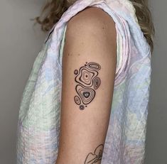 a woman with a tattoo on her arm