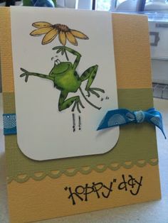 a handmade card with a frog on it