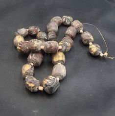 Ancient Old Beautiful Pyu Temple Beads Necklace With Authentic Gold Leaf Round Beads Old Beautiful Pyu Temple Ancient Beads Necklace With Authentic Gold Leaf  Beads Its Very Old Beads Length 48cm Beads Size 17mm Material Stone Hole Size 1.5mm Ancient Necklace, Ancient Beads, Authentic Gold, Leaf Beads, Afghan Jewelry, Pretty Beads, Coral Stone, Natural Coral, African Jewelry