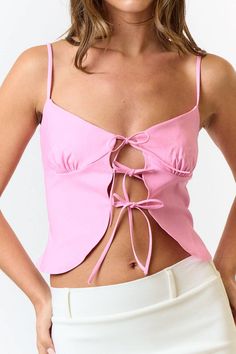 This pink front tie cami top is a total vibe! 😍 The soft pastel pink is perfect for brightening up your outfits, and the front tie detail adds that extra cute touch. With adjustable spaghetti straps and lightweight fabric, it's all about comfort and style. Pair it with your go-to high-waisted jeans or a flirty skirt for a look that's effortlessly chic. Whether you're heading to brunch or out with friends, this cami is your new go-to for a fresh, fun look! 🌟💖 Total Pink Outfit, Pink Outfit, New Arrival Dress, Blue Jacket, Cami Top, Cami Tops, Soft Pastel, Bridal Collection, Pastel Pink