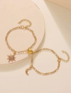 Introducing our Sun & Moon Friendship Bracelets, the perfect symbol of everlasting friendship. Crafted with 14K gold-plated Cuban links, these bracelets come as a pair, connected by a magnetic heart. One bracelet features a delicate moon charm, while the other showcases a radiant sun. Not only are these bracelets stunning in design, but they're also built to last. Made waterproof and non-tarnish, they can withstand any adventure you embark on together. Whether it's a beach getaway or a hiking ex Sun Moon Friendship, Bracelets Bff, Bff Jewelry, Bff Bracelets, Embellished Fashion, Bracelet Sets, Moon Bracelet, Charm Chain