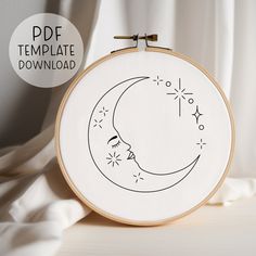 the embroidery pattern is being displayed in front of a white background with an image of a crescent