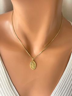 "This is a gold St. Michael oval pendant necklace.  This beautiful pendant is 16 karat gold over 925 sterling silver, measures 22x14mm and comes on 14 karat gold filled box chain.  Model has a small neck, is wearing 16\" length.  Also available in 18 or 20 inch length.  Please choose gold or silver version which is all completely 925 sterling silver, including box chain .  Choose your length in the drop-down list. Comes in the gift box ready to present. This would make a great gift for women, girls or boys. I do make a larger oh well, Saint Michael pendant necklace for men on another listing. Please pay attention to delivery time on this listing. I do offer shipping upgrades at checkout for faster delivery." Necklace Women Silver, Catholic Confirmation Gifts, St Michael Necklace, Catholic Confirmation, St Michael Pendant, Saint Michael, Great Gifts For Women, Protection Necklace, Confirmation Gifts