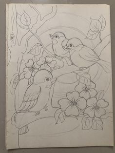 a drawing of two birds on a branch with flowers