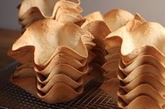 some food is sitting on top of a cooling rack and it looks like they are made out of wood