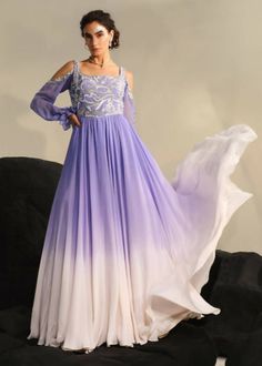 Inspired by the surreal magnificence of mermaid scales, the Attina gown is designed to make you feel like Royalty. It highlights a cold shoulder bishop sleeve, an embroidered torso and double ombre gown. Ombré Gown, Ombre Dresses, Ombre Gown, Purple Gowns, Orchid Purple, Ombre Dress, Printed Gowns, White Ombre, Actor Picture