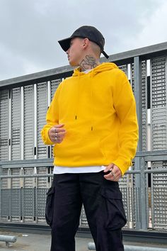 Available In Black, Heathered Grey, White, Navy, Red, Orange, Pink, Blue, And Yellow Hood With Drawstring Long Sleeve Kangaroo Pocket Ribbing On Cuffs And Hem 80% Cotton 20% Polyester Imported | Mens Tyson Hoodie in Yellow size XL by Fashion Nova Yellow Top Outfit, Bright Colored Outfits, Hoodie Outfit Men, Outfit Yellow, Tall Height, Style Outfits Men, 2023 Color, Yellow Pants, Black Dress Outfits